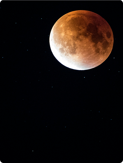 A copper-colored moon during a lunar eclipse