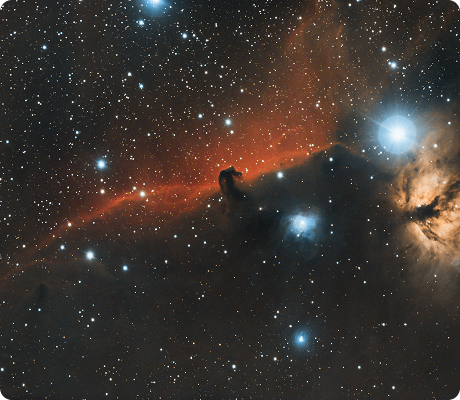 The Horsehead Nebula surrounded by stars and glowing gas