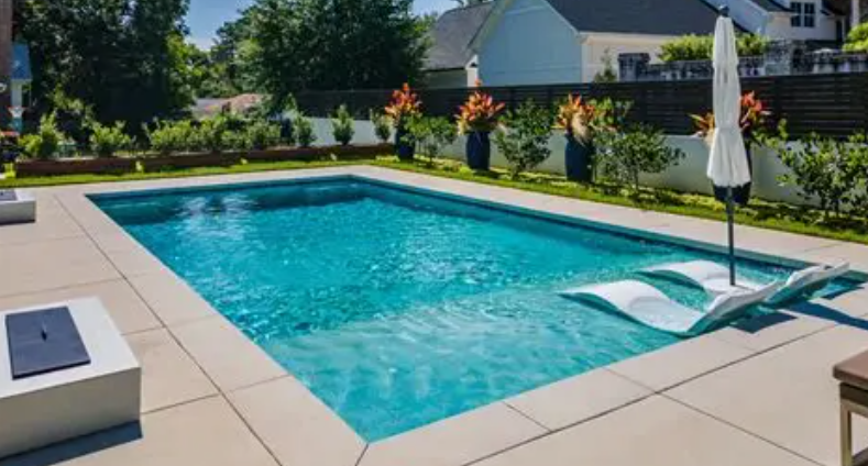 Guests floating in a clear blue swimming pool