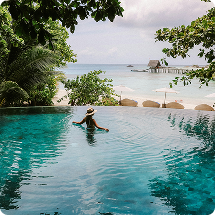 Tropical resort pool overlooking the beach