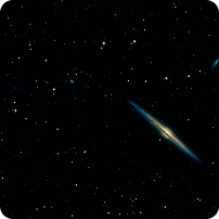 An edge-on galaxy surrounded by a field of stars