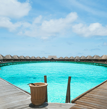 Clear turquoise lagoon with wooden deck