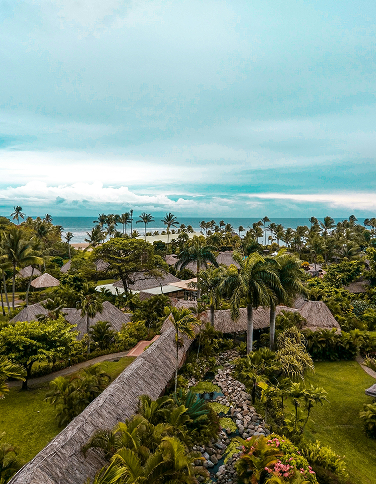 Aerial view of tropical villa grounds near the coast