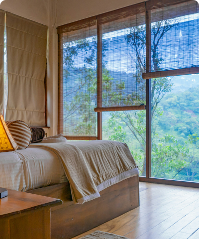 Poolside bungalow bedroom with a large window